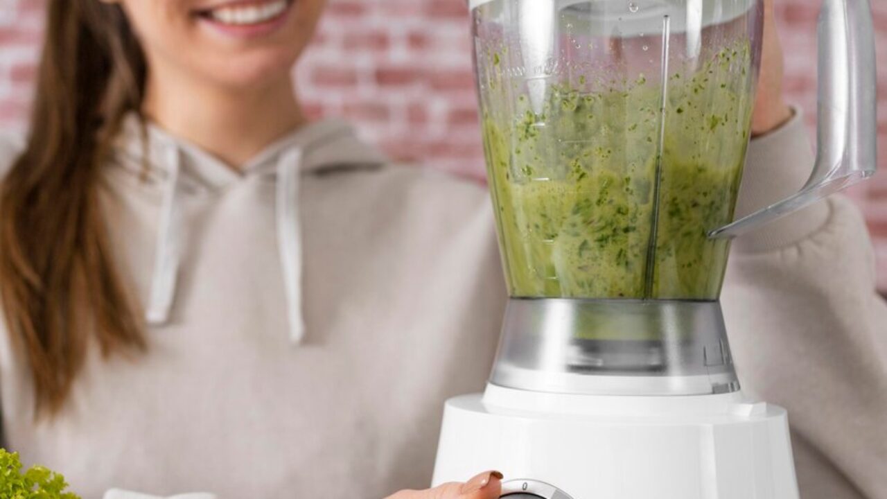 close-up-smiley-woman-preparing-smoothie_23-2148898621-1280x720.jpg